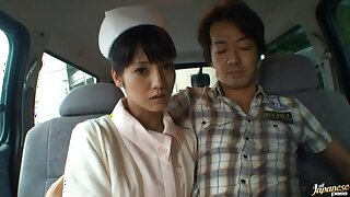 Naughty Japanese nurse sucking a dick in the back of a car